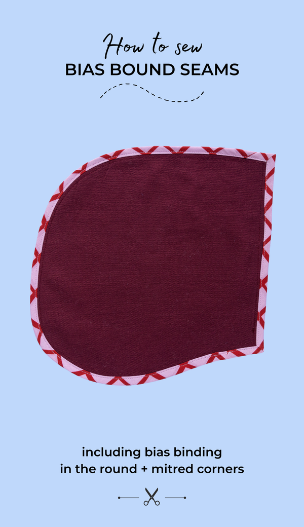 How to sew bias bound seams including bias binding in the round and mitred corners. Text over image of pocket in burgundy twill with pink and red cotton bias binding around the edge.